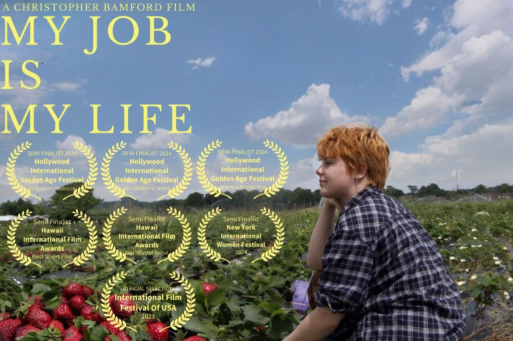 My Job Is My Life short film poster featuring the title, the directors name Christopher Bamford, and 7 film festival laurels. The laurels are for Hollywood Internatonal Golden Age Awards, Hawaii InternationalFilm Awards, New York International Women Festival and International Film Festival of USA.
There is also the main female character featured, Emily who is played by Rub Hyde, sat in a strawberry farm field. The field is actually located at Grays Pick Your Own Farm in Wokingham UK.